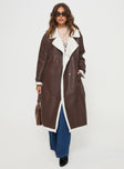 Longline coat Lapel collar, long sleeves, shearling cuffs & detail, single button fastening at cuff, twin hip pockets, double-breasted front  Non-stretch, shearling-like material lined
