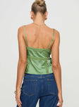 Silky top V neckline, adjustable straps, lace trim detail, split hem at sides with tie Non-stretch material, lined bust