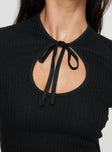 Knit top Cap sleeves, cut out detail at bust with tie fastening Good stretch, unlined 