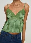Silky top V neckline, adjustable straps, lace trim detail, split hem at sides with tie Non-stretch material, lined bust