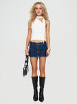Low-rise denim mini skort Belt looped waist, zip & button fastening, faux back pockets Non-stretch material, unlined