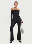 Jumpsuit Off-the-shoulder style, inner silicone strip at bust, flared sleeves with split, frill detail at bust, flared leg Good stretch, fully lined  Princess Polly Lower Impact 