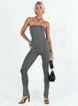 Strapless jumpsuit Inner silicone strip at bust Invisible zip fastening at back Split at cuff Slim leg Fully lined