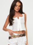 Crop top Fixed shoulder straps, pleated trimming, button fastening down front Non-stretch material, unlined 