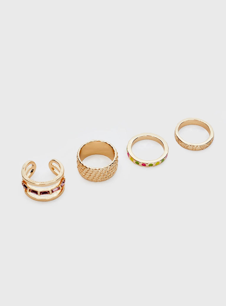 Gold toned ring pack  Four rings in pack, diamonte & colour glass detail