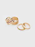 Gold toned ring pack  Four rings in pack, diamonte & colour glass detail