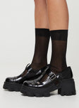 Loafer heels, faux patent leather material Buckle fastening, platform base, rounded toe, treaded sole