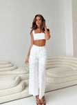 Matching set Broderie anglaise material Crop top Invisible zip fastening at side High waisted pants Wide leg Belt looped waist Zip and button fastening