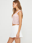 Mini skirt Mid-rise, lace trim and rose detail at waist, slightly sheer Slight stretch, fully lined 
