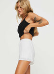High rise plisse shorts Elasticated waistband, drawstring with tie fastening Non-stretch material, fully lined 