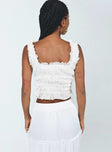 Crop top Crinkle material Fixed straps Square neckline Tie fastening at front Shirred waistband Frill hem
