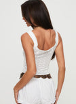 Crop top Fixed shoulder straps, pleated trimming, button fastening down front Non-stretch material, unlined 