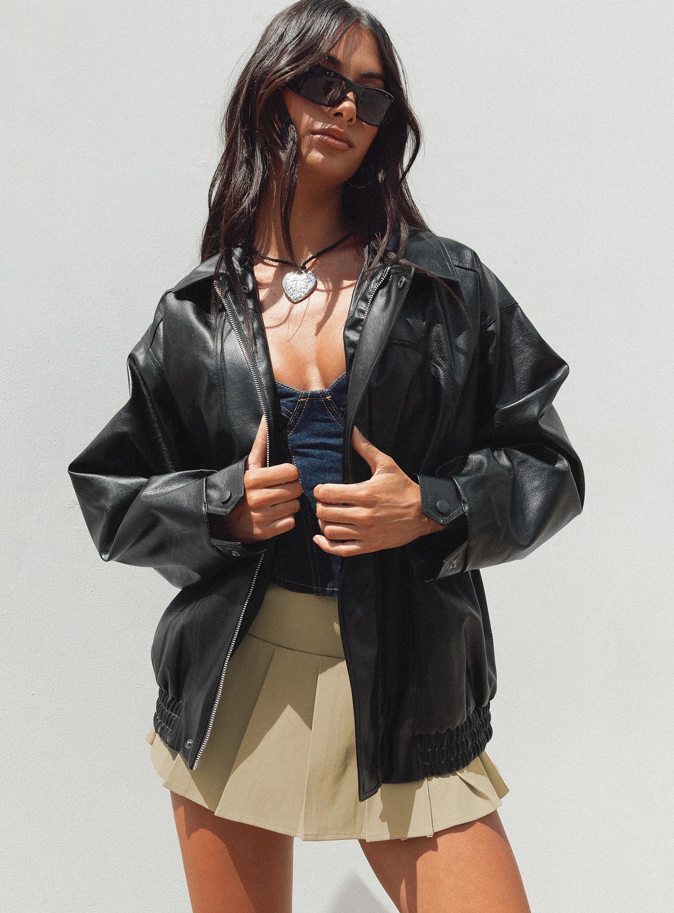 Faux leather jacket Zip fastening at front  Classic collar Twin hip pockets  Elasticated waistband 