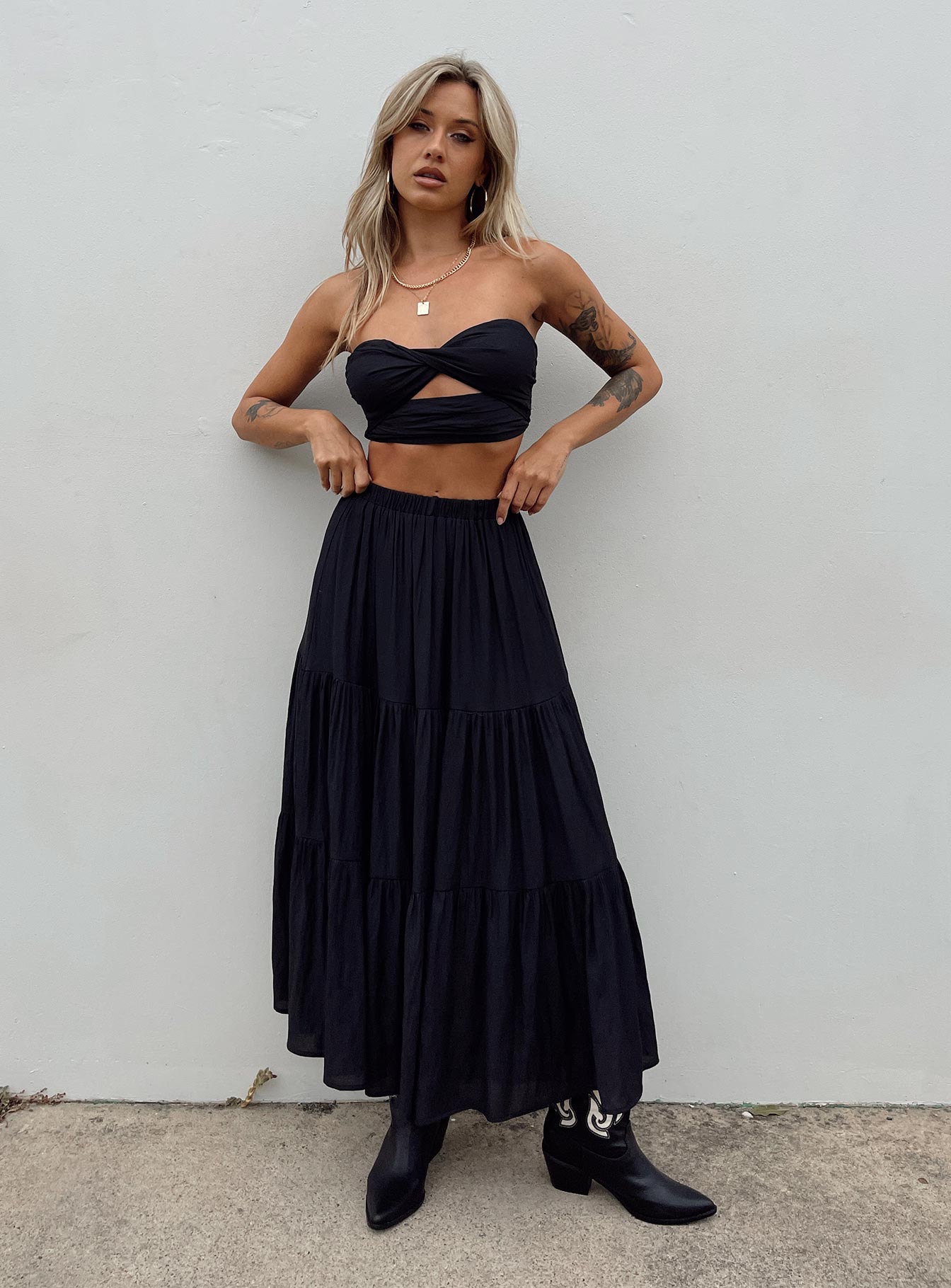 Black matching set Crop top Removable shoulder straps  Inner silicone strip at bust  Twisted bust  Cut out detail  Shirred back  Zip fastening  High waisted midi skirt  Elasticated waistband  Layered design 