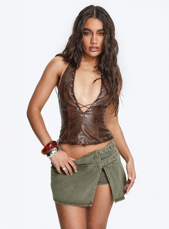   side view of model wearing Princess Polly Generous Wrap Buckle Skort Washed Khaki Mini Skirts Skirts 