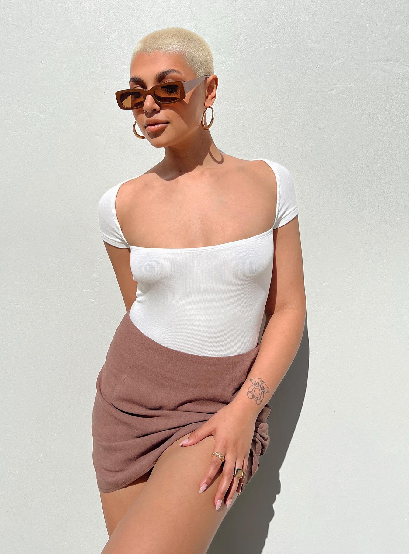 side view of model wearing Princess Polly Langley Bodysuit White Short Sleeves Square Neck 