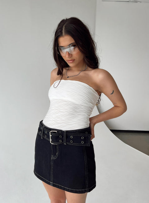 side view of model wearing Princess Polly Makena Strapless Bodysuit White Petite Sleeveless 