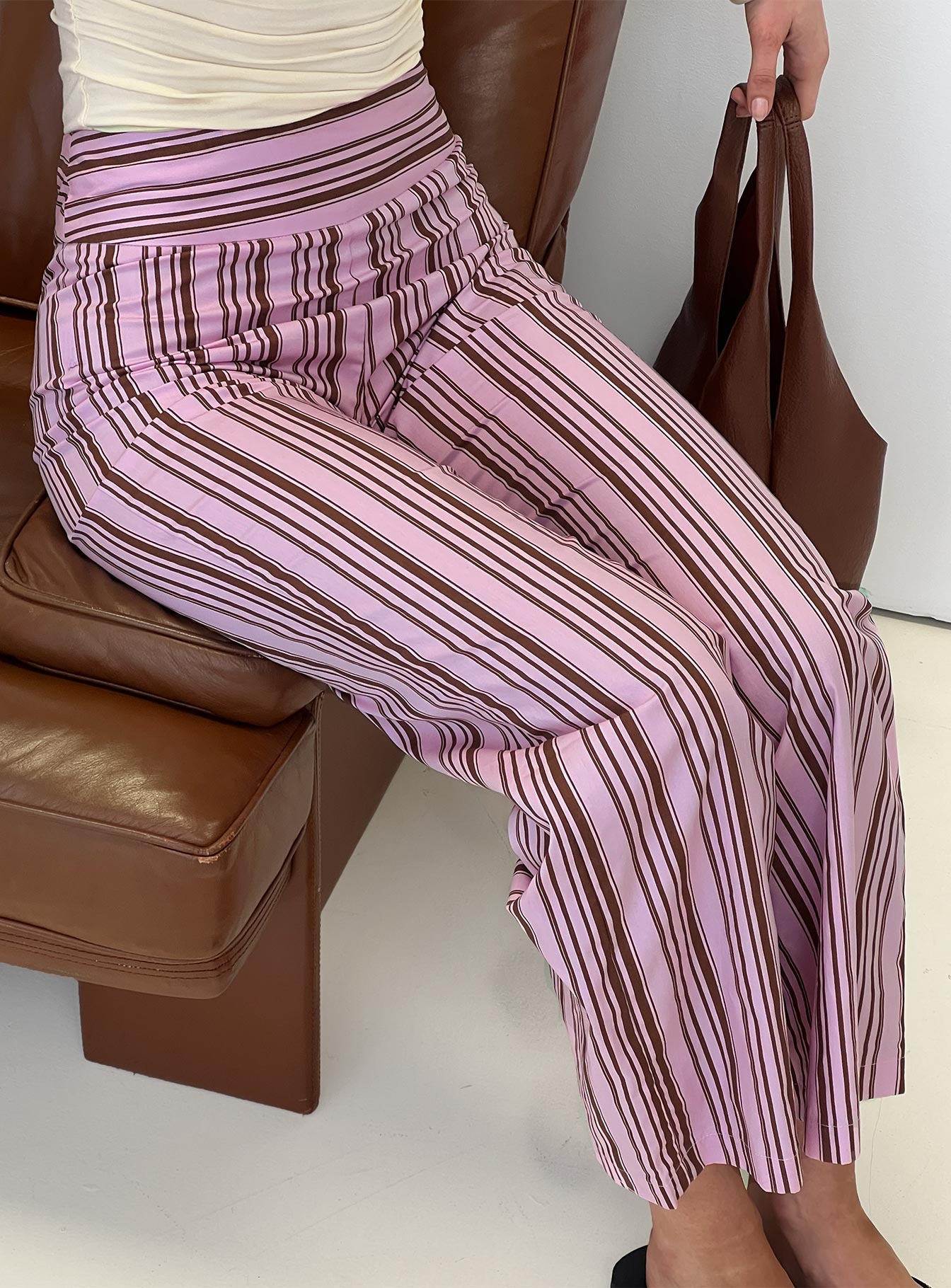 side view of model wearing Princess Polly Leocadie Pants Pink Stripe High Waisted Pants 