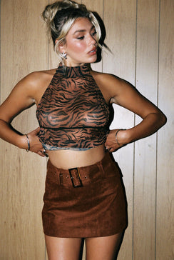   side view of model wearing Princess Polly Movita Belted Mini Skirt Brown 