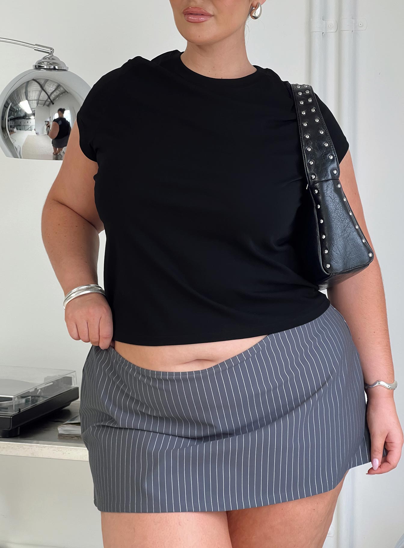 back view of model wearing Princess Polly Prestige Longline Baby Tee Black Curve Short Sleeves Crew Neck 