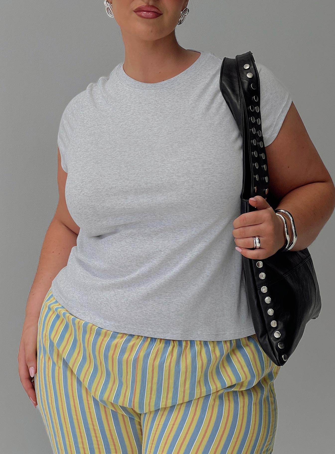 front view of model wearing Princess Polly Prestige Longline Baby Tee Grey Curve Sleeveless Crew Neck 