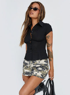   side view of model wearing Princess Polly Voltage Denim Mini Skirt Camouflage 