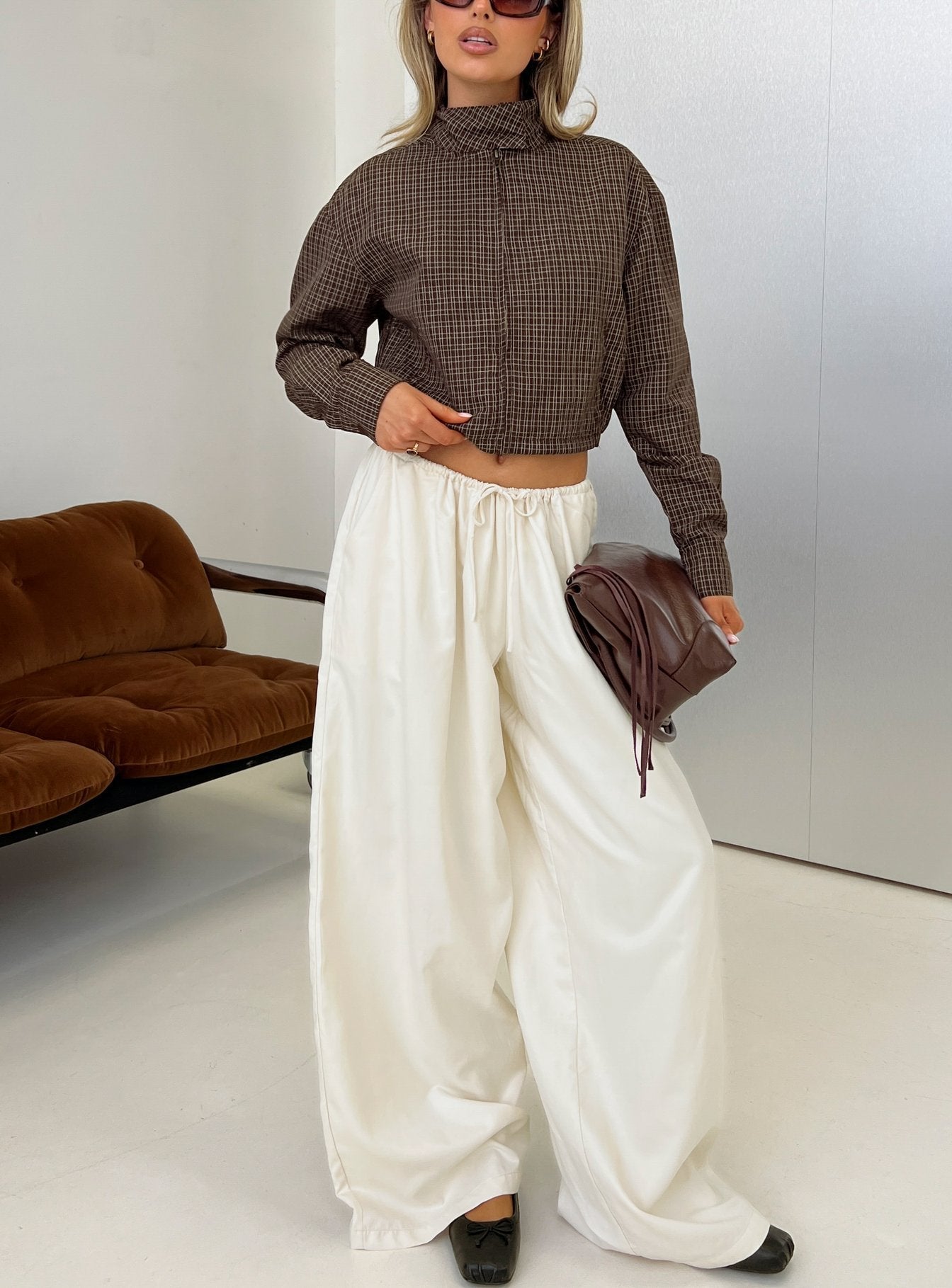Showcasing the Bungala Oversized Relaxed Pants Ivory womens-regular-pants in high-rise wide-leg silhouette front view of model wearing Princess Polly