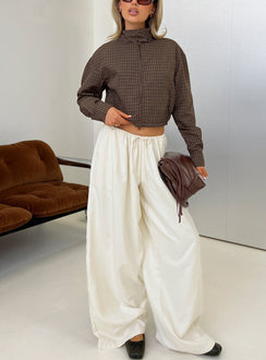 Showcasing the Bungala Oversized Relaxed Pants Ivory womens-regular-pants in high-rise wide-leg silhouette front view of model wearing Princess Polly