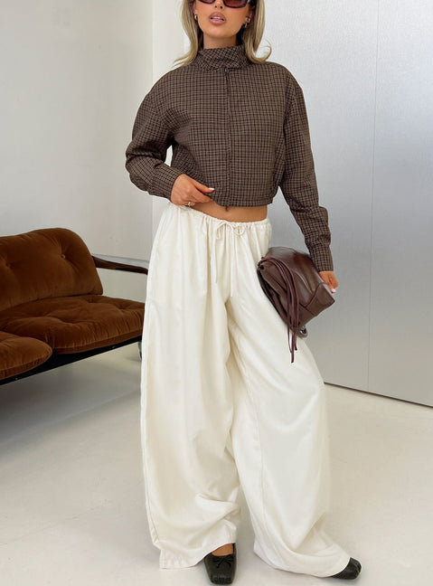 Showcasing the Bungala Oversized Relaxed Pants Ivory womens-regular-pants in high-rise wide-leg silhouette front view of model wearing Princess Polly