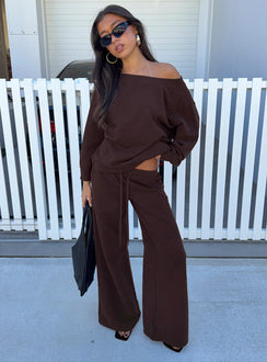 Showcasing the Wellness Off The Shoulder Jumper Brown in women's jumpers with long length and oversized fit front view of model wearing Princess Polly