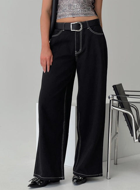 side view of model wearing Princess Polly Naylor Wide Leg Jeans Mid Black High Waisted 