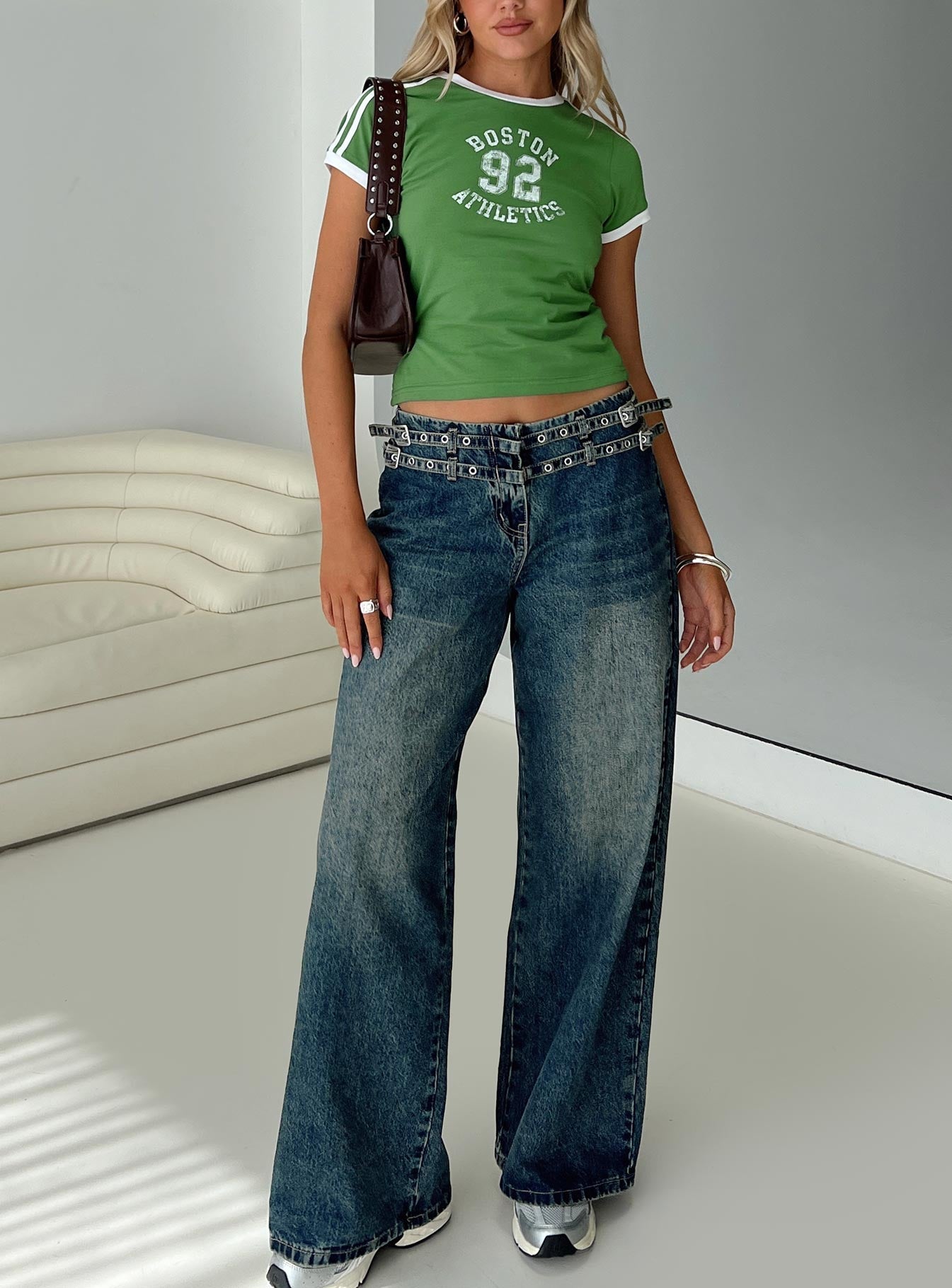 front view of model wearing Princess Polly Baccarat Belted Denim Pant Dark Blue Low Rise Jeans 