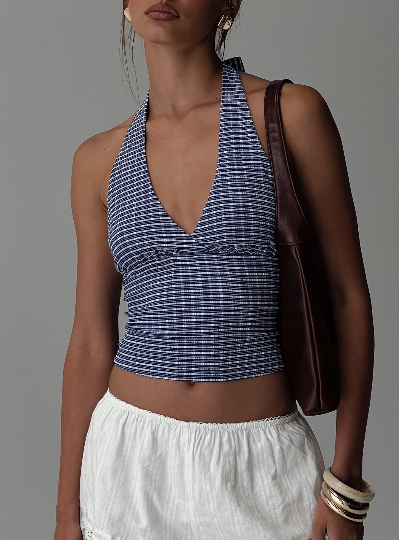 front view of model wearing Princess Polly Whimsy Halter Top Navy Gingham Sleeveless Sleeveless Plunger Plunger 