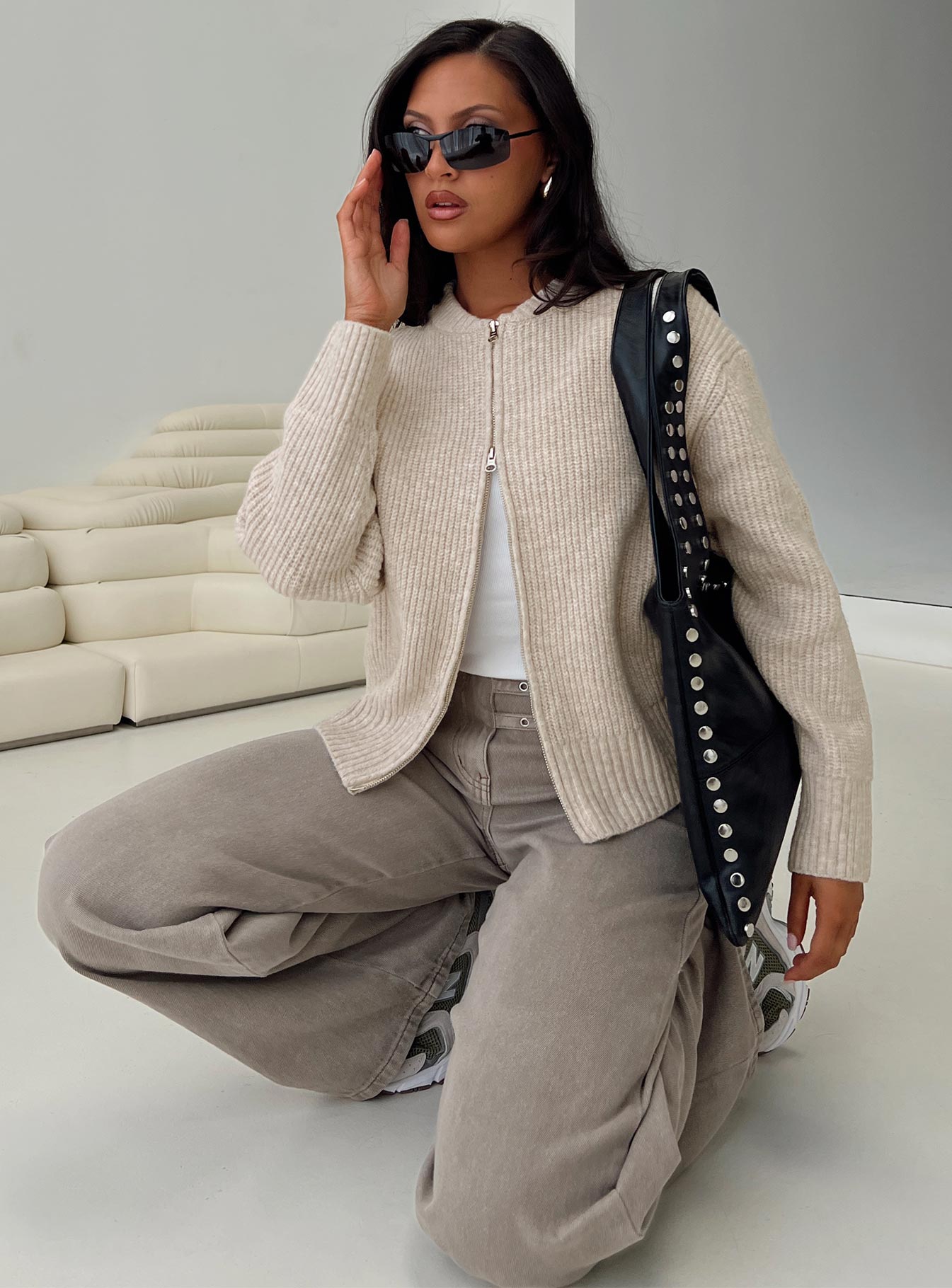 side view of model wearing Princess Polly Lexene Zip Through Jumper Oat regular 