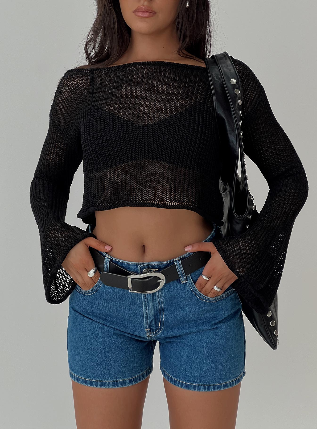 Featuring the Cafe Pari Sweater Black womens jumpers in short length front view of model wearing Princess Polly