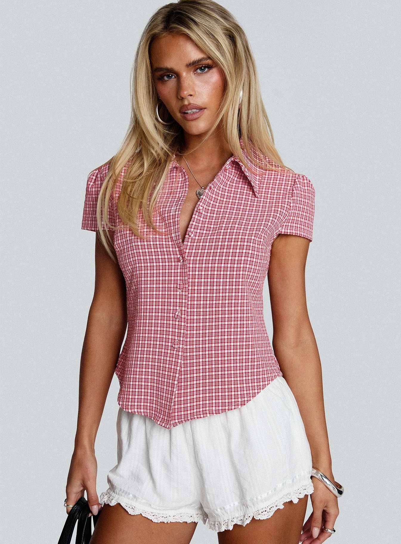 front view of model wearing Princess Polly Float Away Button Up Top Red Check Short Sleeves V-Neck 