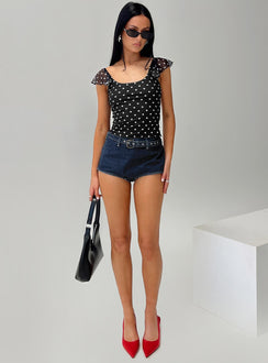 front view of model wearing Princess Polly Halston Briefs Blue Denim High Waisted Shorts 