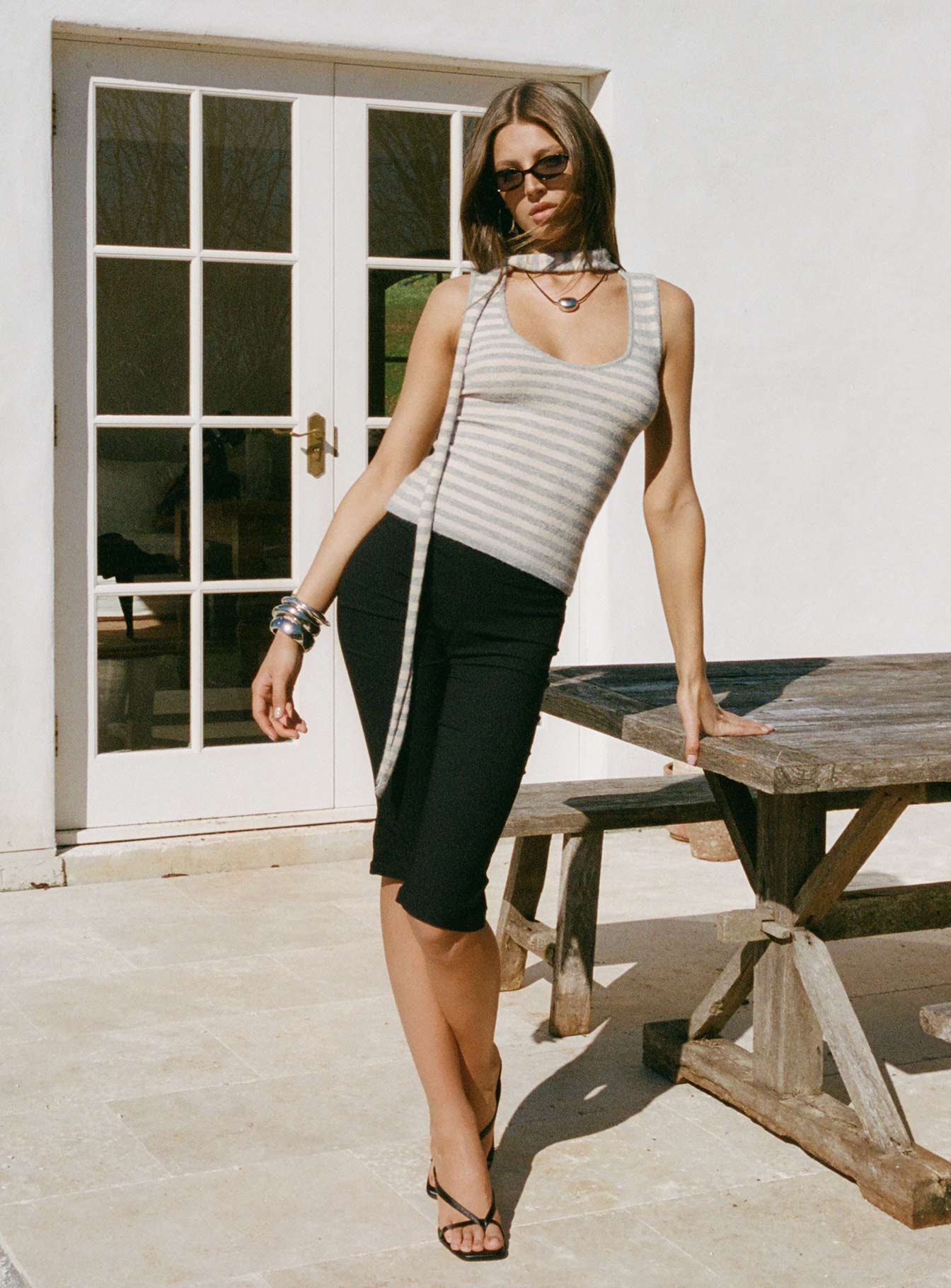 side view of model wearing Princess Polly Samaira Capri Pant Black Mid Rise Pants 