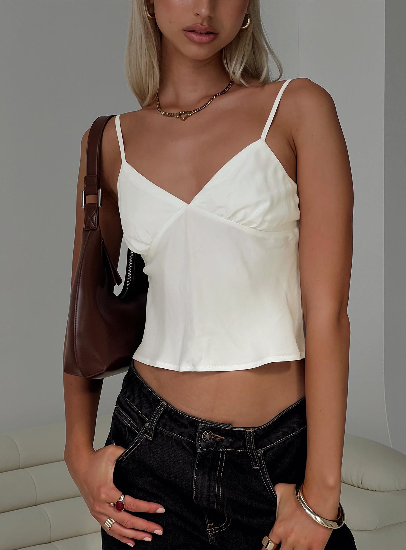 front view of model wearing Princess Polly Lance Top Cream Sleeveless Plunger 