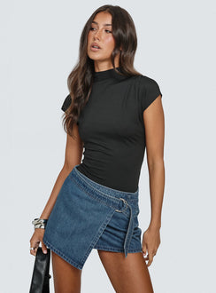   side view of model wearing Princess Polly Elinora Wrap Mini Skirt Mid Blue Wash Mini Skirts Skirts 