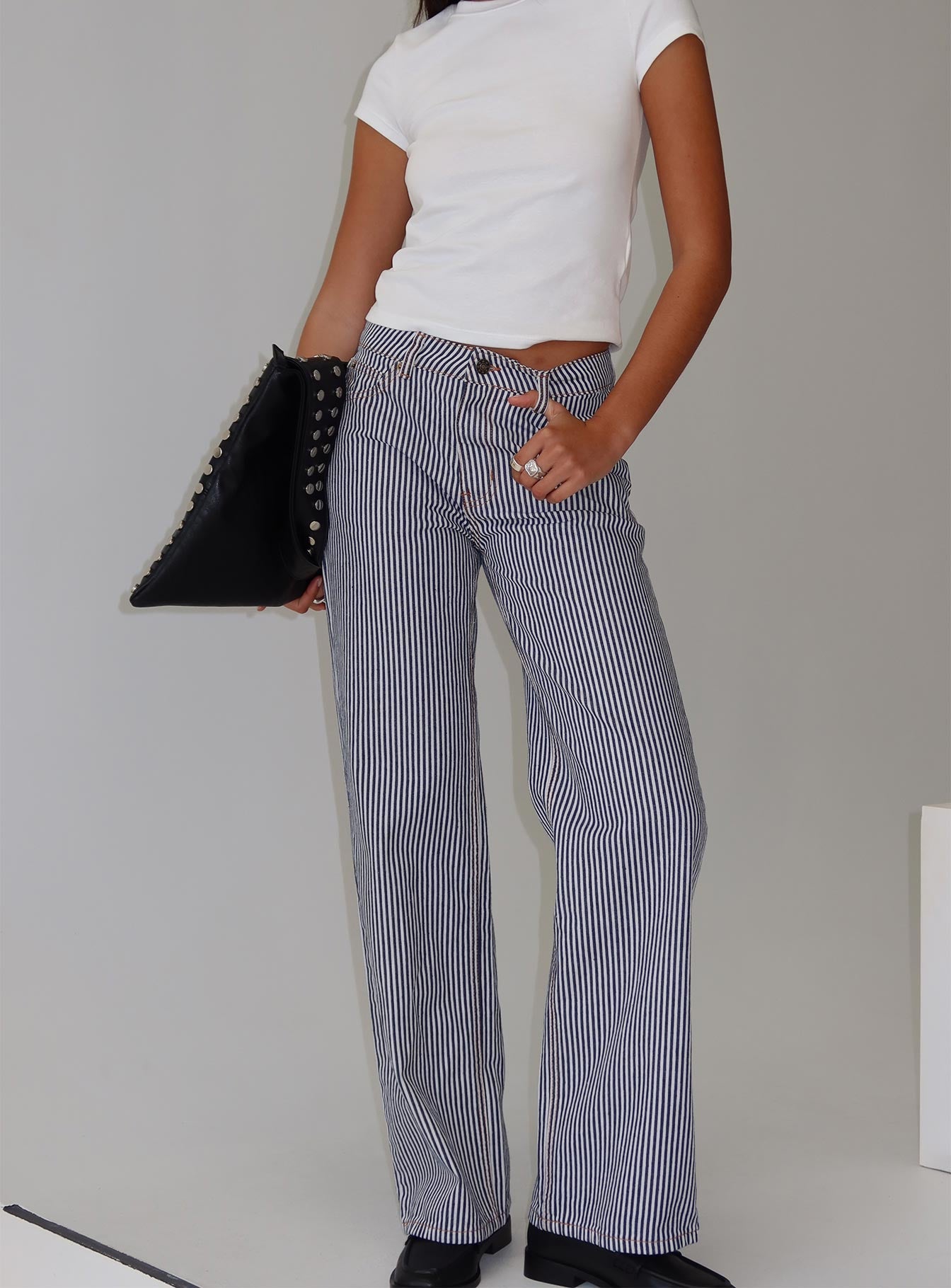 back view of model wearing Princess Polly Top Model Jean Navy Stripe Low Rise Pants 