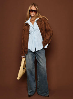 side view of model wearing Princess Polly Paltrow Mid Rise Wide Leg Cargo Jeans Mid Blue Wash Petite Mid Rise Jeans 