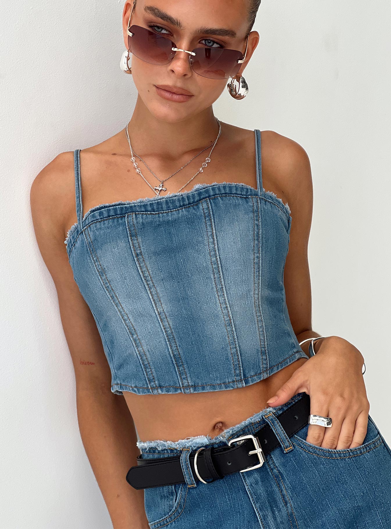 back view of model wearing Princess Polly Vihaan Top Blue Wash Sleeveless Square Neck 