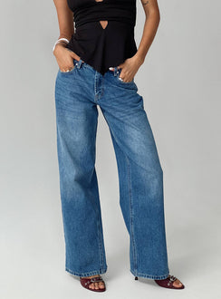 front view of model wearing Princess Polly Serenitia Mid Rise Relaxed Jeans Mid Blue Wash Petite Mid Rise 