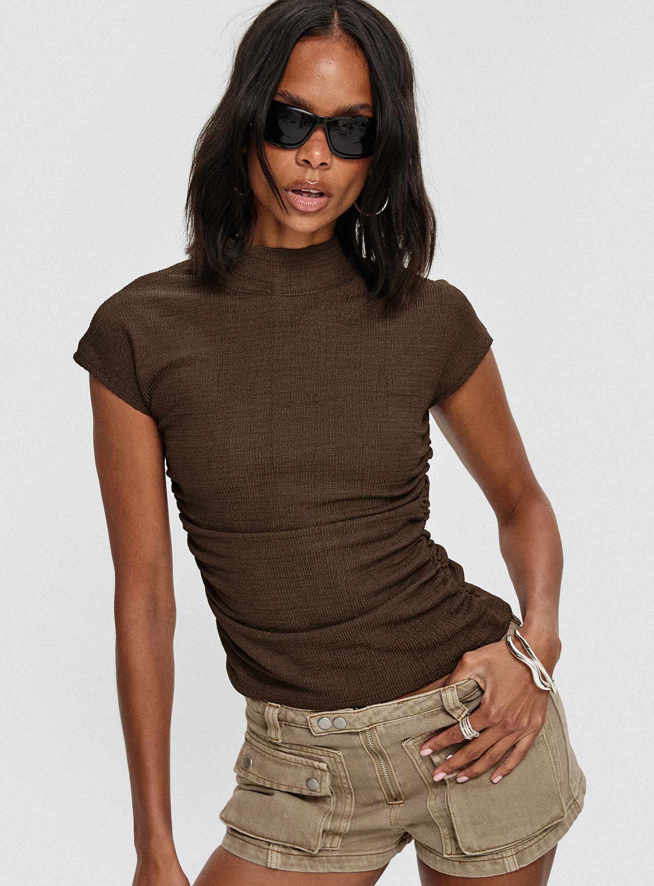 front view of model wearing Princess Polly Make A Plan Top Brown Short Sleeves High Neck 