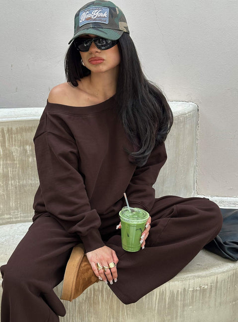 Showcasing the Wellness Off The Shoulder Jumper Brown in women's jumpers with long length and oversized fit front view of model wearing Princess Polly