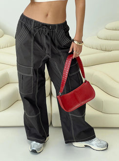 back view of model wearing Princess Polly Soria Cargo Pants Black Low Rise Pants 