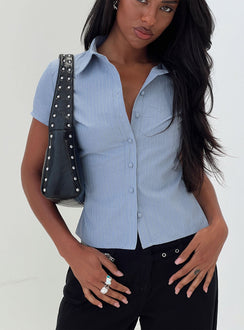 side view of model wearing Princess Polly Lift Off Button Up Top Blue Short Sleeves V-Neck 