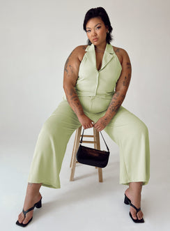 Matching set High waisted pants  Zip & button fastening  Elasticated back band  Belt looped waist  Twin hip pockets Wide leg  Vest top  Lapel collar  Button front fastening 