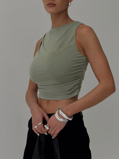 side view of model wearing Princess Polly Hold Em High Neck Top Green Sleeveless Crew Neck 